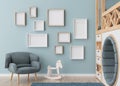 Various empty picture frames on blue wall in modern child's room. Mock up interior in contemporary, scandinavian