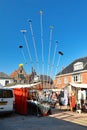 Various expandable wet mops and brooms at weekly market on` De Groeneplaats` square in city `Den Burg` on island Texel Royalty Free Stock Photo