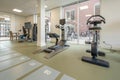 Various fitness and cardio equipment in a gym room