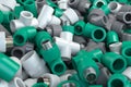 Various fittings of pvc plastic pipes and tubes in heap. Plumbing ackground