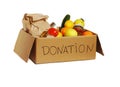 Various food in a cardboard donation box, isolated