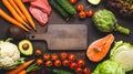 Various food raw products: vegetables, beef meat, fish salmon and empty wooden cutting board in centre, dark rustic Royalty Free Stock Photo
