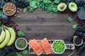 Various foods high in magnesium forming a border on a wooden table. Royalty Free Stock Photo