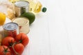 Various foodstuff on white wooden table. Food donation