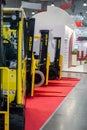 Various forklift trucks and warehouse vehicles at the International exhibition of transport and logistics services
