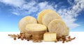 Various forms cheese hazelnuts, walnuts, dried fruit, background sky