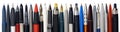 Various fountain pens, ball pens and pencils Royalty Free Stock Photo