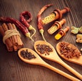 Various fragrant Herbs and Spices over wooden background