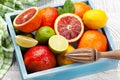 Various fresh citrus fruits in box. Bood orange, lime, lemon Royalty Free Stock Photo