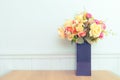 Various fresh flowers arrangement in vase on wooden table Royalty Free Stock Photo