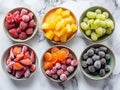 various fresh fruits in plate on white marble table. served with elegance