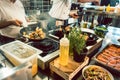 Various fresh ingredients on the stove of a commercial kitchen Royalty Free Stock Photo