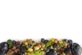 Various fresh summer berries and fruits on white background. Ripe grape, blueberries, blackberries, plums. Berries and fruits at b Royalty Free Stock Photo