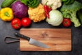 Various fresh vegetables, cutting board and knife Royalty Free Stock Photo