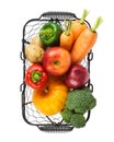 Various fresh vegetables and fruits in a wire basket. Isolated Royalty Free Stock Photo