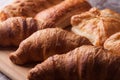 Various freshly baked pastries on wooden cutting board Royalty Free Stock Photo