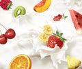 Various fruits falling into a sea of milk, causing splashes. Royalty Free Stock Photo