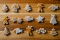 Various funny gingerbread shapes on a brown wooden table