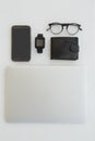 Various gadgets, spectacles and wallet on white background Royalty Free Stock Photo