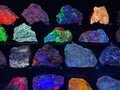 Various gem stones glow under fluorescent light Royalty Free Stock Photo