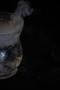 Various glasses and dishes with water and dry ice