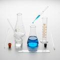 Various glassware including a beaker, Erlenmeyer flask, and graduated Royalty Free Stock Photo