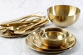 Various Gold Plate, Bowl, Spoon, and Fork Royalty Free Stock Photo