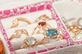 Various gold rings and earrings with precious stones and pearls Royalty Free Stock Photo