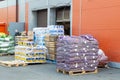 various goods on pallets in front of the warehouse.