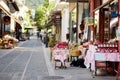 Various goods sold at small shops at the pedestrian area at center of Kalavryta town near the square and odontotos train station, Royalty Free Stock Photo