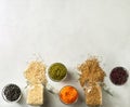 Various grains and beans, including rice, buckweat, lentils, Mung beans in glass jars on the table in the kitchen