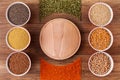 Various grains and seeds on the table and in bowls - top view