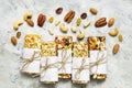 Various granola bars with nuts, dry fruits on gray background Royalty Free Stock Photo