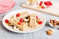 Various granola bars on table background. Cereal granola bars. Superfood breakfast bars with oats, nuts and berries Royalty Free Stock Photo