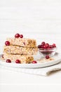 Various granola bars on table background. Cereal granola bars. Superfood breakfast bars with oats, nuts and berries Royalty Free Stock Photo