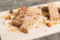 Various granola bars on table background. Cereal granola bars. Superfood breakfast bars with oats, nuts and berries Royalty Free Stock Photo