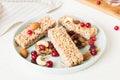 Various granola bars on table background. Cereal granola bars. Superfood breakfast bars with oats, nuts and berries Royalty Free Stock Photo