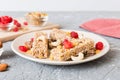 Various granola bars on table background. Cereal granola bars. Superfood breakfast bars with oats, nuts and berries Royalty Free Stock Photo