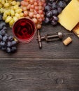 Various grapes, glass of wine and cheese Royalty Free Stock Photo