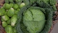 Various green cabbages in basked rotating on daylight