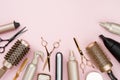 Various hair dresser tools on pink background with copy space Royalty Free Stock Photo