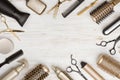 Various hair dresser tools on wooden background with copy space