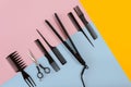 Various hair styling devices on the color blue, yellow, pink paper background, top view Royalty Free Stock Photo