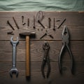With a wooden handle rusted pliers and assorted nails and screws Royalty Free Stock Photo