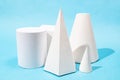 various handcrafted paper geometric models on blue Royalty Free Stock Photo