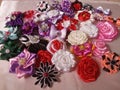 various handicraft flower brooches made of colorful ribbons and satin fabrics