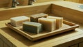 Assorted Natural Soap Bars on Bamboo Tray in a Bathroom Setting Royalty Free Stock Photo