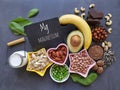Various healthy foods rich in magnesium with the symbol Mg and the inscription Magnesium