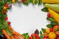 Various healthy vegetarian food background. Frame of organic raw vegetables, herbs and spices on the white kitchen table Royalty Free Stock Photo