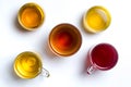 Various herbal tea in glass cups on white Royalty Free Stock Photo